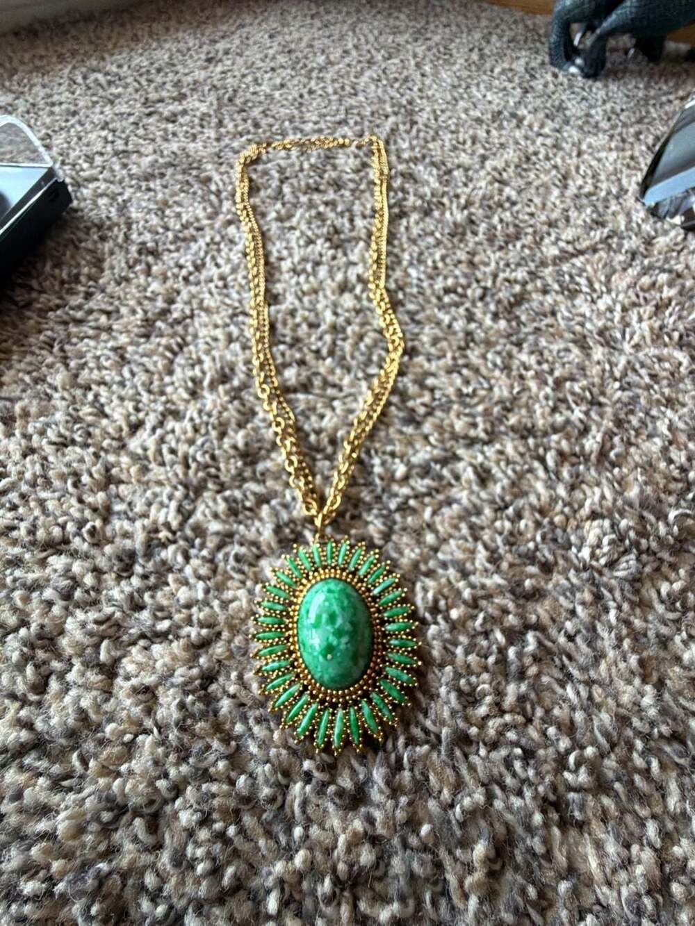 Vintage Celebrity Gold Tone Sunburst Pendant Necklace with Green Marbled Faux Ja